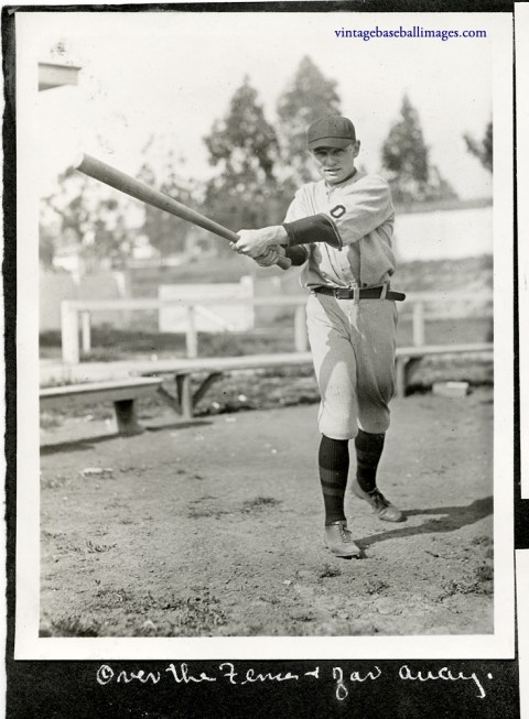 Vintage snapshot of an Occidental college baseball player swinging a bat, c 1922