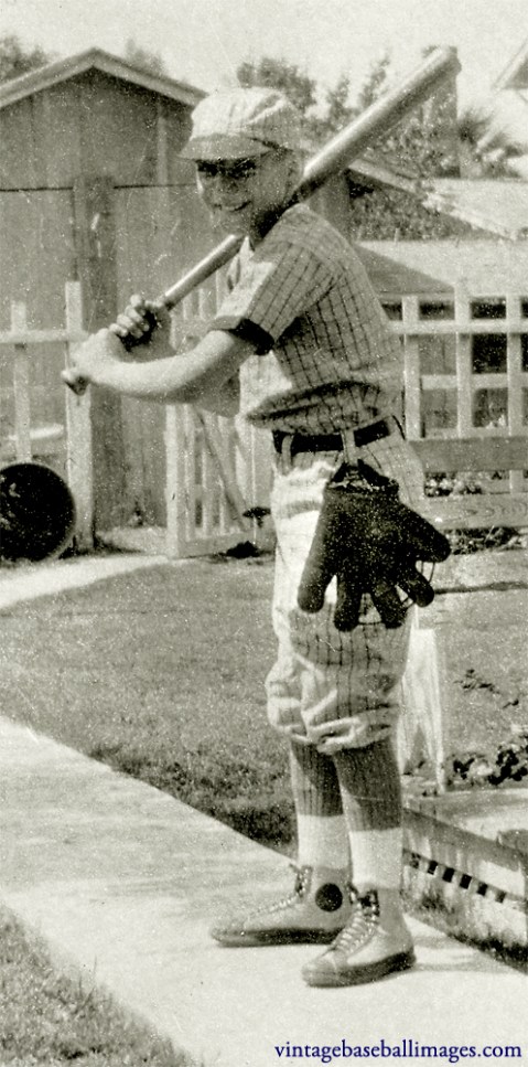 Close-up of boy in batting stance, showing the glove hanging from his hip