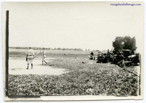 Vintage snapshot of a circa 1910s baseball game watched by a small crowd